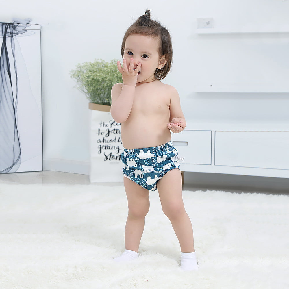 "Playful toddler girl exploring potty training pants"