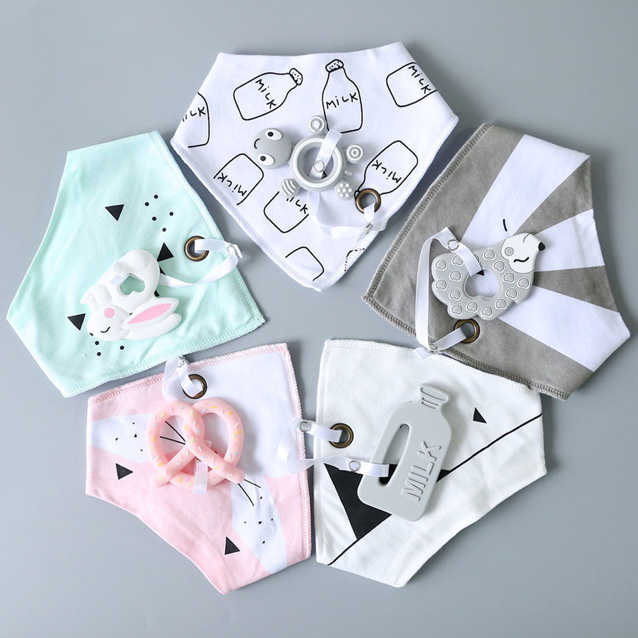 "Soft and absorbent cotton bibs for babies - perfect for mealtime and drool protection"
